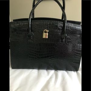 Black crocodile purse.